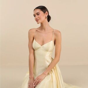 Paride shiny light yellow gathered lace up midi Dress